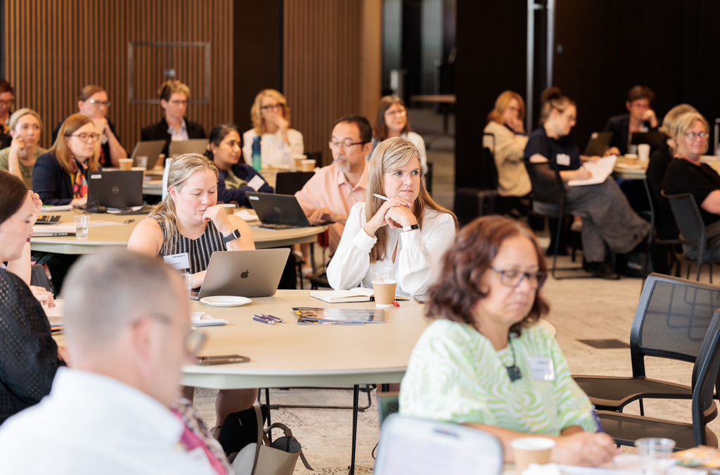 Group of people listening to a presentation