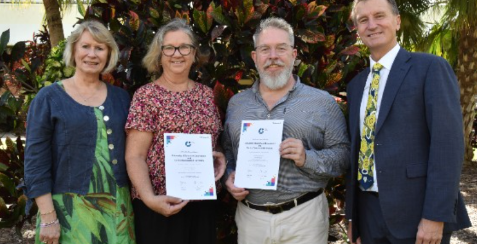 People holding certificates