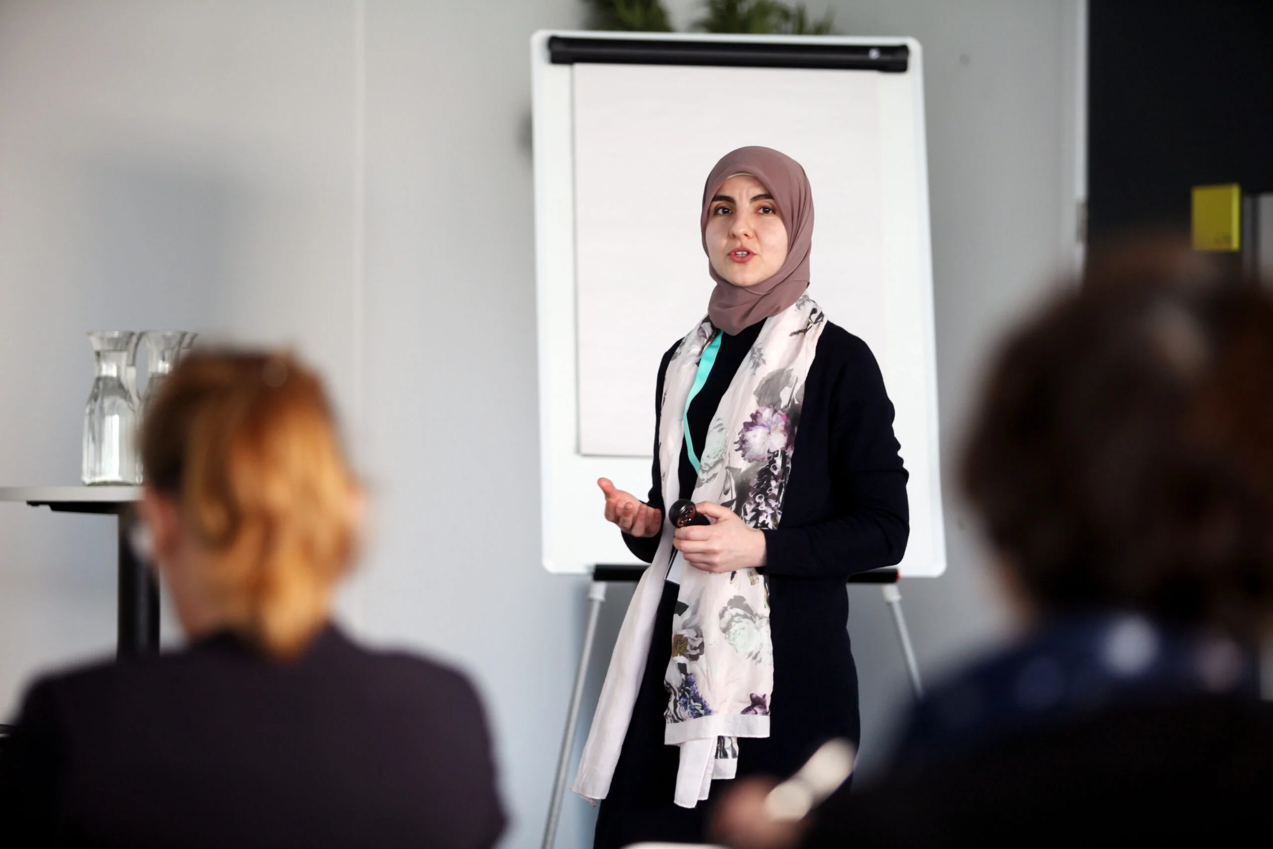 Woman standing and explaining