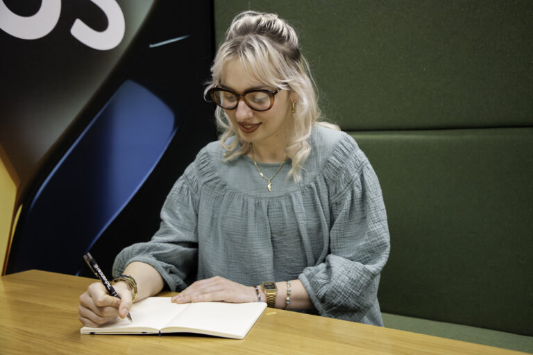Woman writing in a notebook