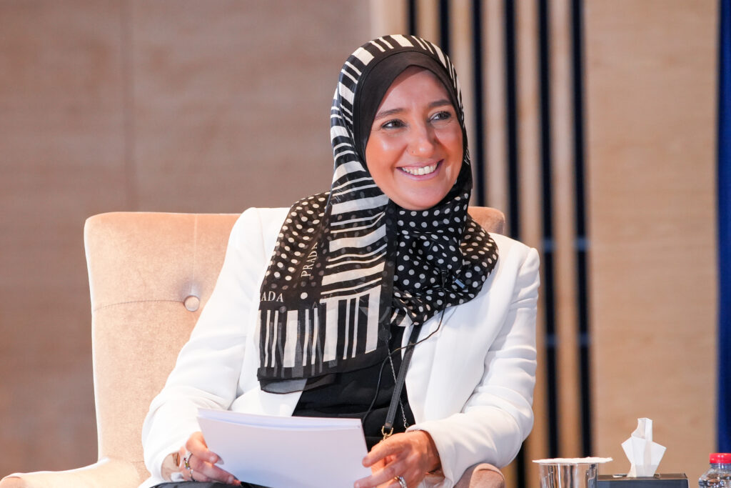 A woman at a table with some papers