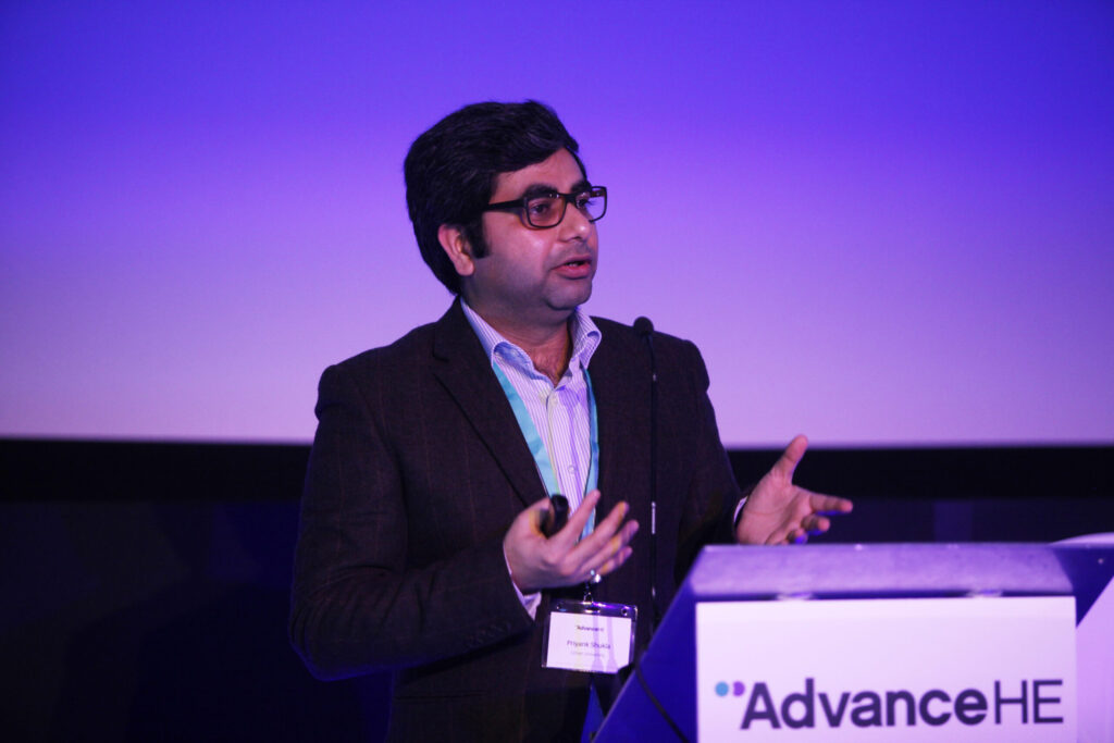 Man presenting at lectern