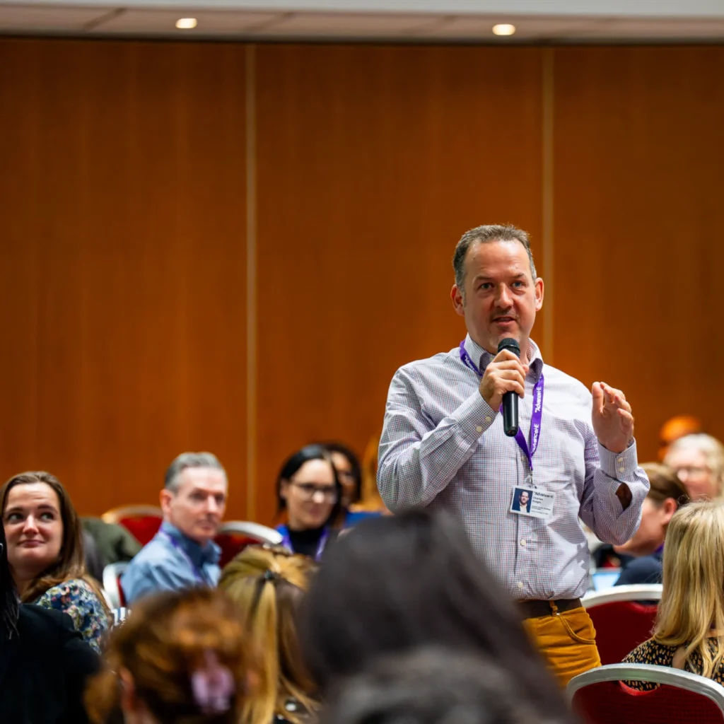 Charles Knight speaking at a conference